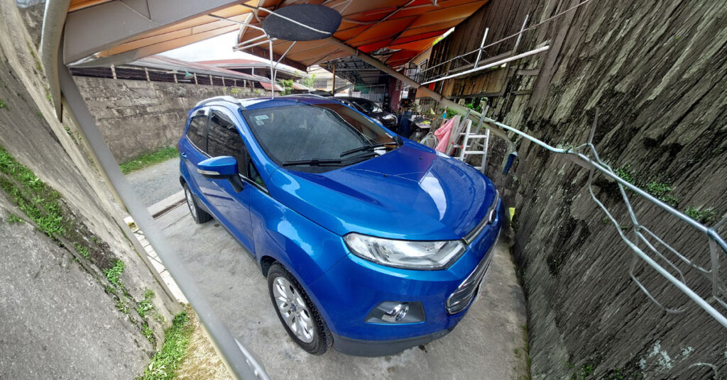Blue car parked in a shed representing God's provision and faithfulness
